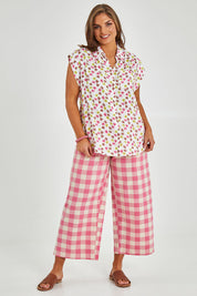 Model Monique wearing size 14 of the Cap Sleeve Shirt in colour Retrodaisy (White), from the front, showing the whole outfit