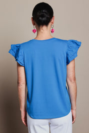 Model Katie wearing size 10 of the Ruffle Sleeve Top in colour Frenchblue (Blue), from the back