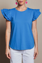 Model Katie wearing size 10 of the Ruffle Sleeve Top in colour Frenchblue (Blue), from the front, cropped image