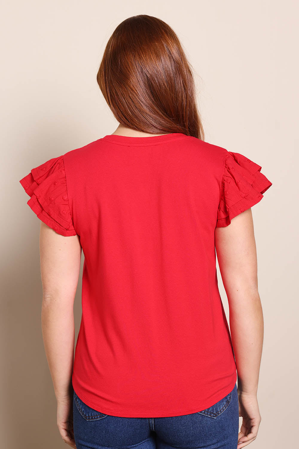 Model Georgiel wearing size 10 of the Ruffle Sleeve Top – Lollipop in colour Lollipop, from the back