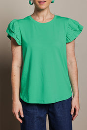 Model Katie wearing size 10 of the Ruffle Sleeve Top in colour Mint (Green), from the front, cropped image