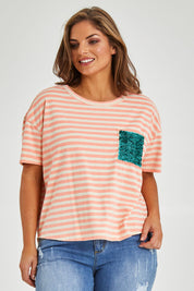 Model Monique wearing size 14 of the Sequin Pocket Tee in colour Sequins, from the front, cropped image