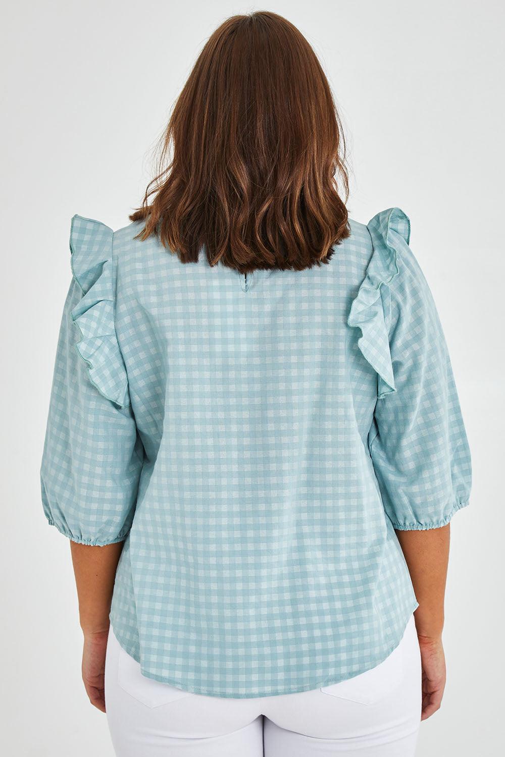 Model Monique wearing size 14 of the Gingham Poet Top in colour Blugingham (Blue), from the back