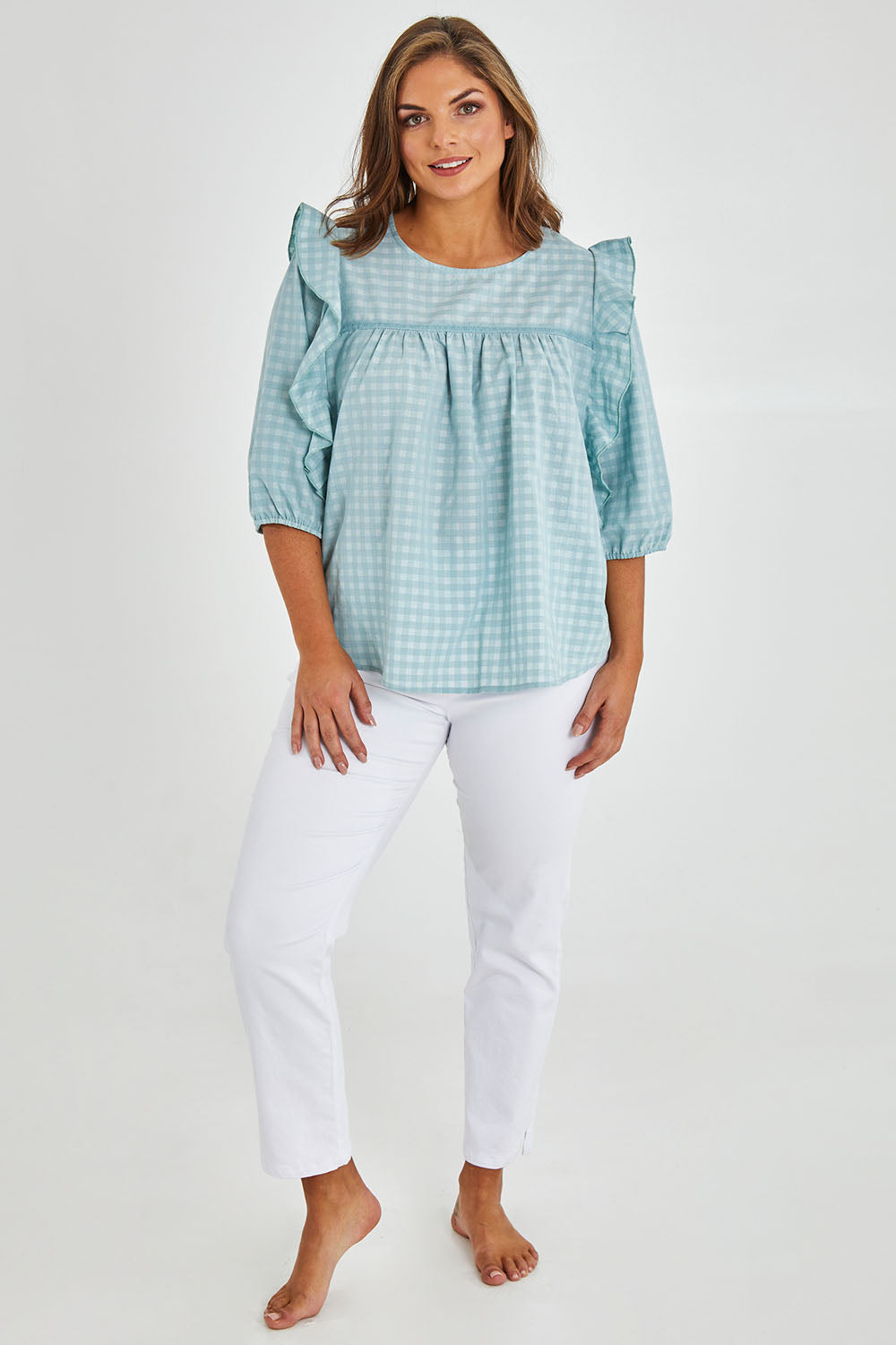Model Monique wearing size 14 of the Gingham Poet Top in colour Blugingham (Blue), from the front, showing the whole outfit