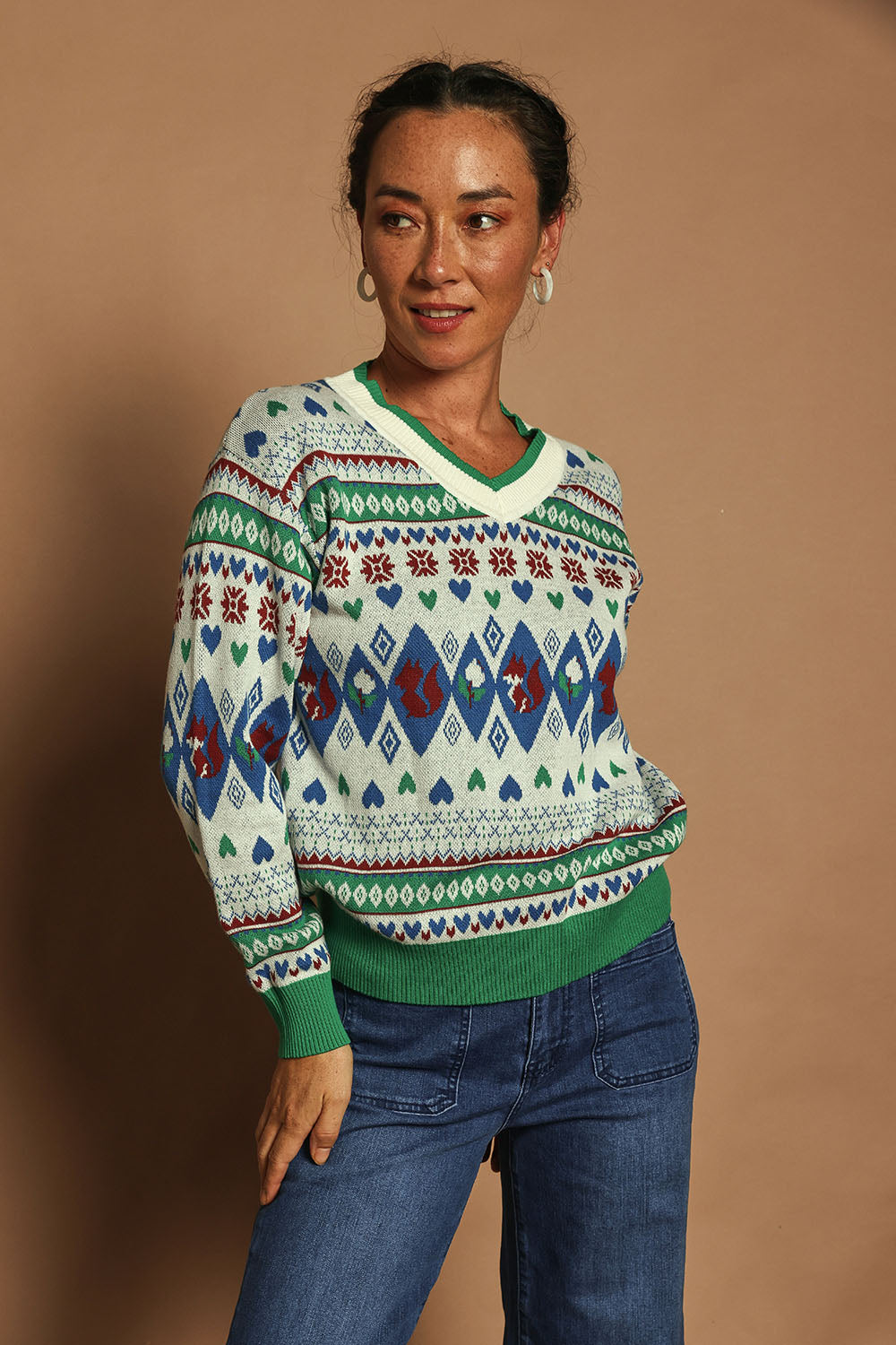 Model Katie wearing size S of the V Neck Foxy Jumper in colour Foxygreen (Green), from the front, showing the whole outfit
