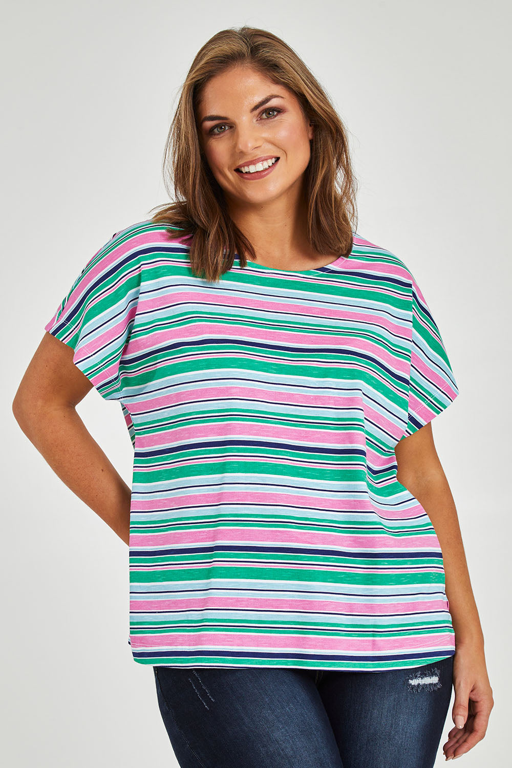 Model Monique wearing size 14 of the Striped Slouch Top in colour Striped (White), from the front, cropped image