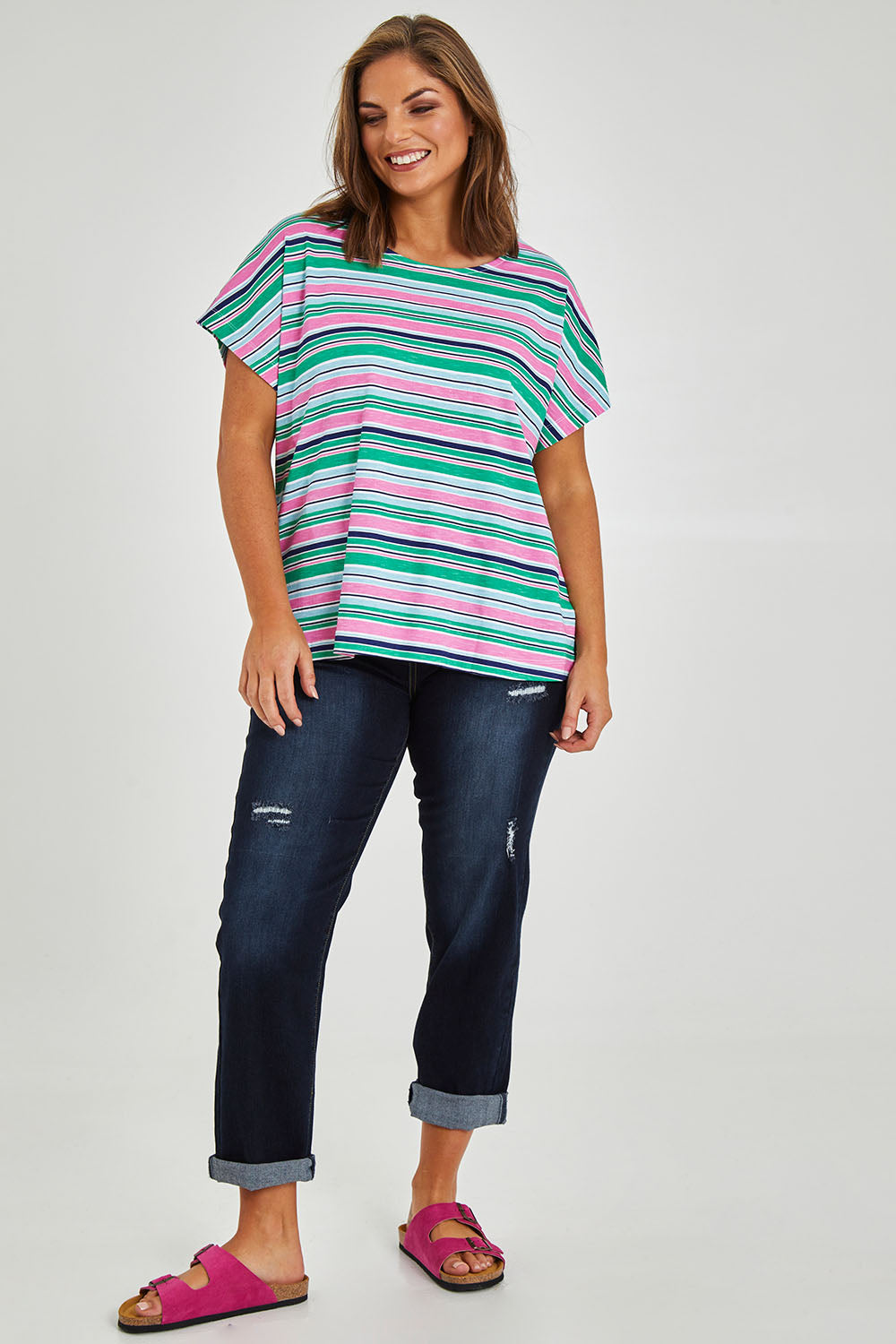 Model Monique wearing size 14 of the Striped Slouch Top in colour Striped (White), from the front, showing the whole outfit