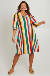 Model Monique wearing size 14 of the V Neck Flounce Sleeve Dress in colour Striped (Blue), from the front, showing the whole outfit