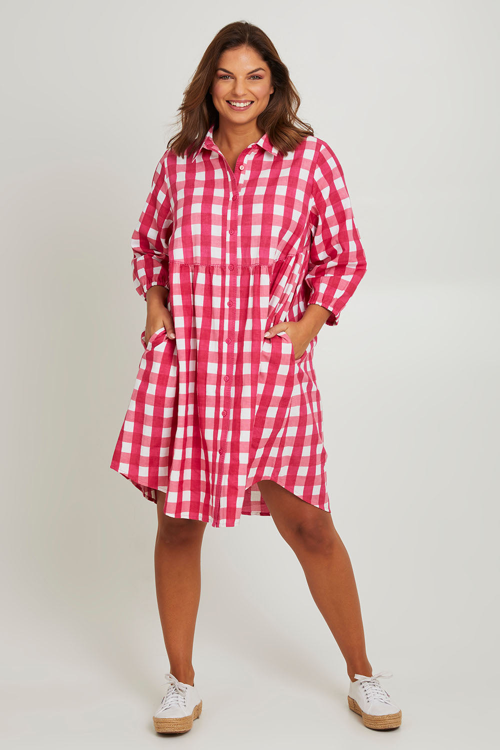 Model Monique wearing size 14 of the Printed Waist Detail Dress in colour Berrycheck (Pink), from the front, showing the whole outfit