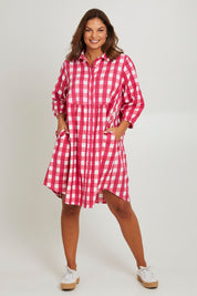 Model Monique wearing size 14 of the Printed Waist Detail Dress in colour Berrycheck (Pink), from the front, showing the whole outfit