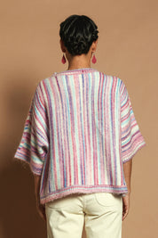 Model Katie wearing size S of the Striped Oversize Sweater in colour Candyfloss (Pink), from the back