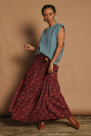 Model Katie wearing the Cable Vest in colour Bluehaze (Blue), from the front, showing the whole outfit