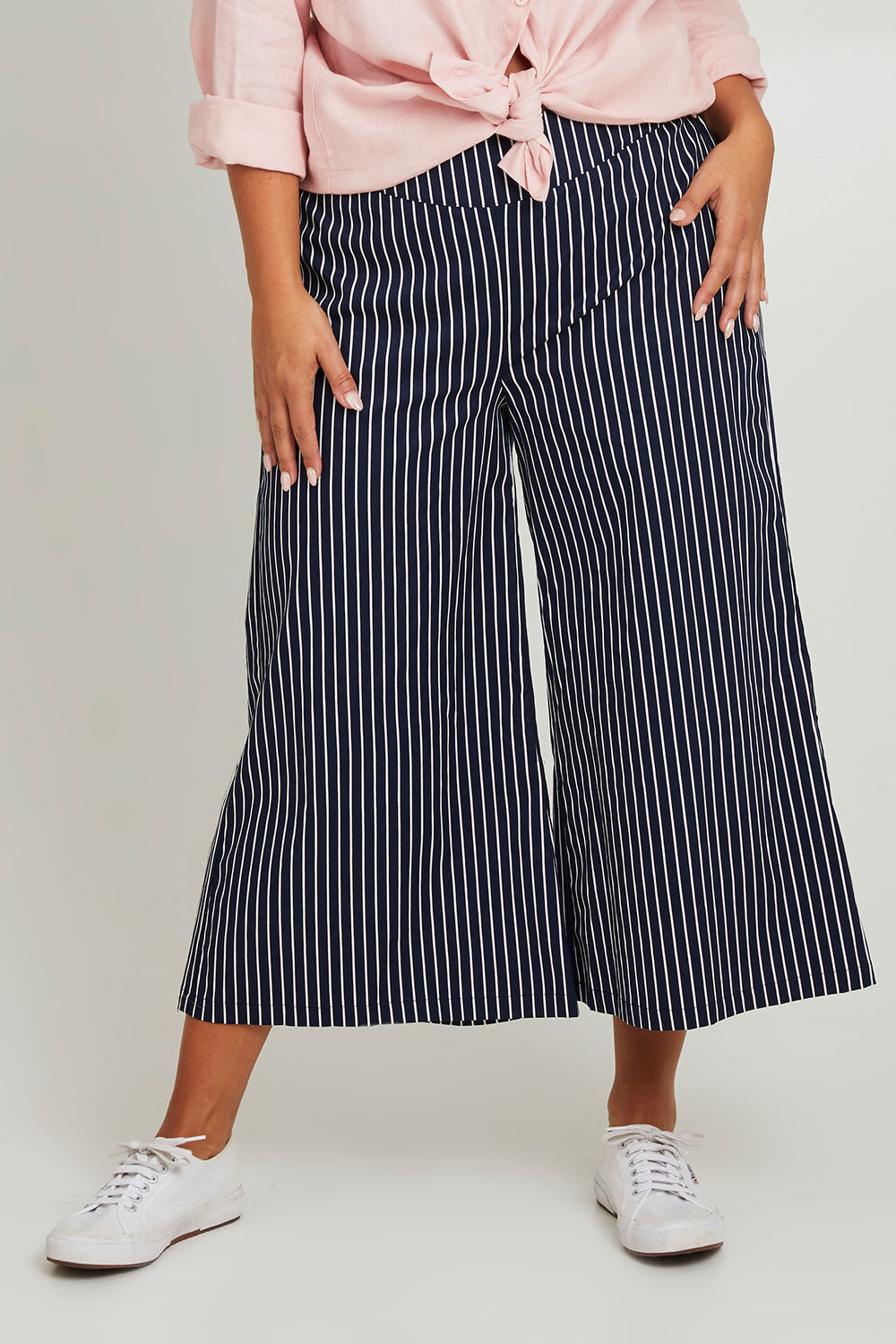 Model Monique wearing size 14 of the Striped Wide Leg Pant in colour Navywhite (Blue), from the front, cropped image