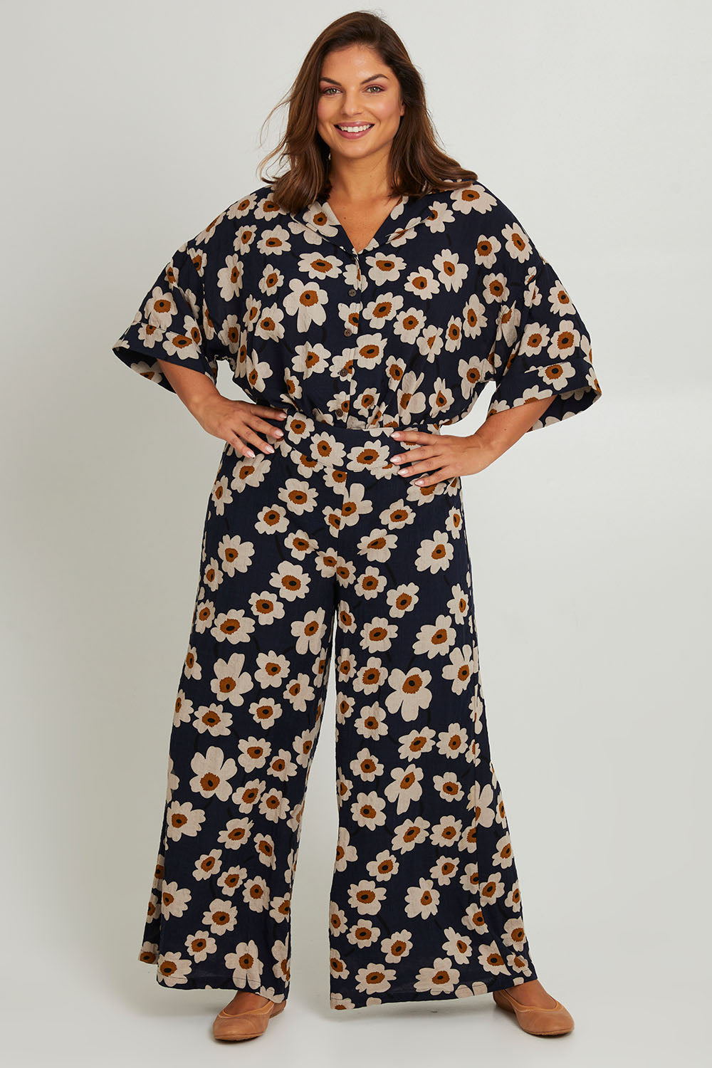 Model Monique wearing size 14 of the Printed Relaxed Pant in colour Daisyfield (Blue), from the front, showing the whole outfit