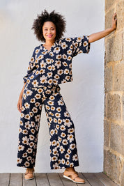 Model Olivia wearing size 10 of the Printed Relaxed Pant in colour Daisyfield (Blue), from the front, showing the whole outfit