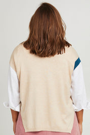 Model Monique wearing size L of the Sheepish Vest in colour Sheepish, from the back