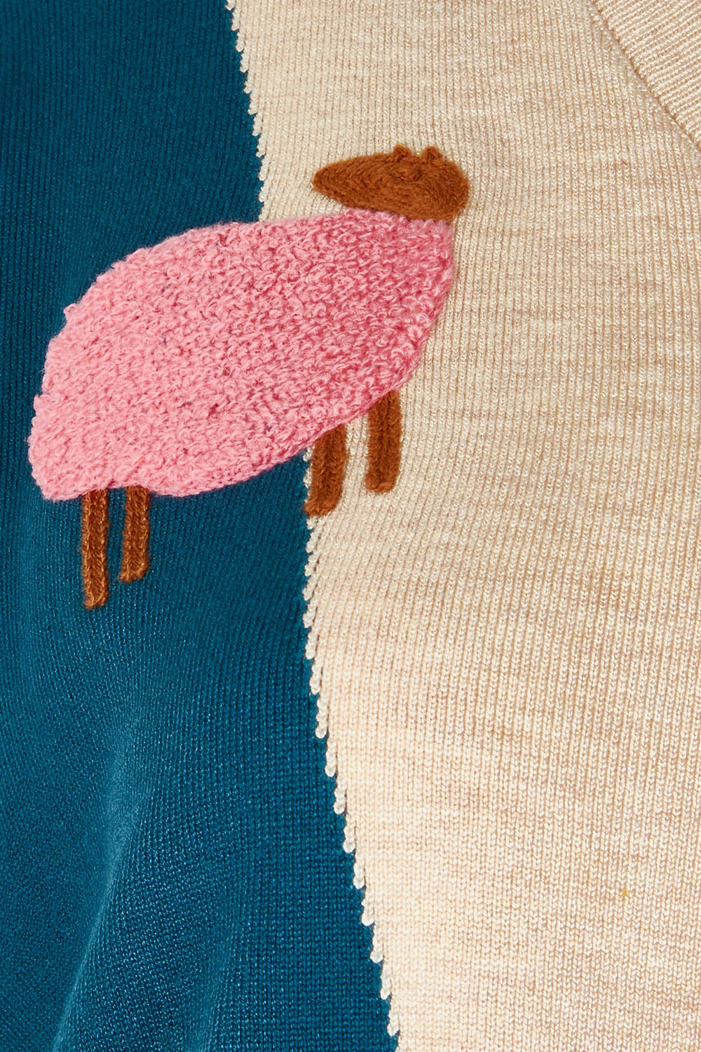 Product shot of the Sheepish Vest in colour Sheepish, detail