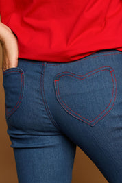 Model Katie wearing size 10 of the Bell Bottom Jeans in colour Middenim (Blue), from the front, showing the whole outfit