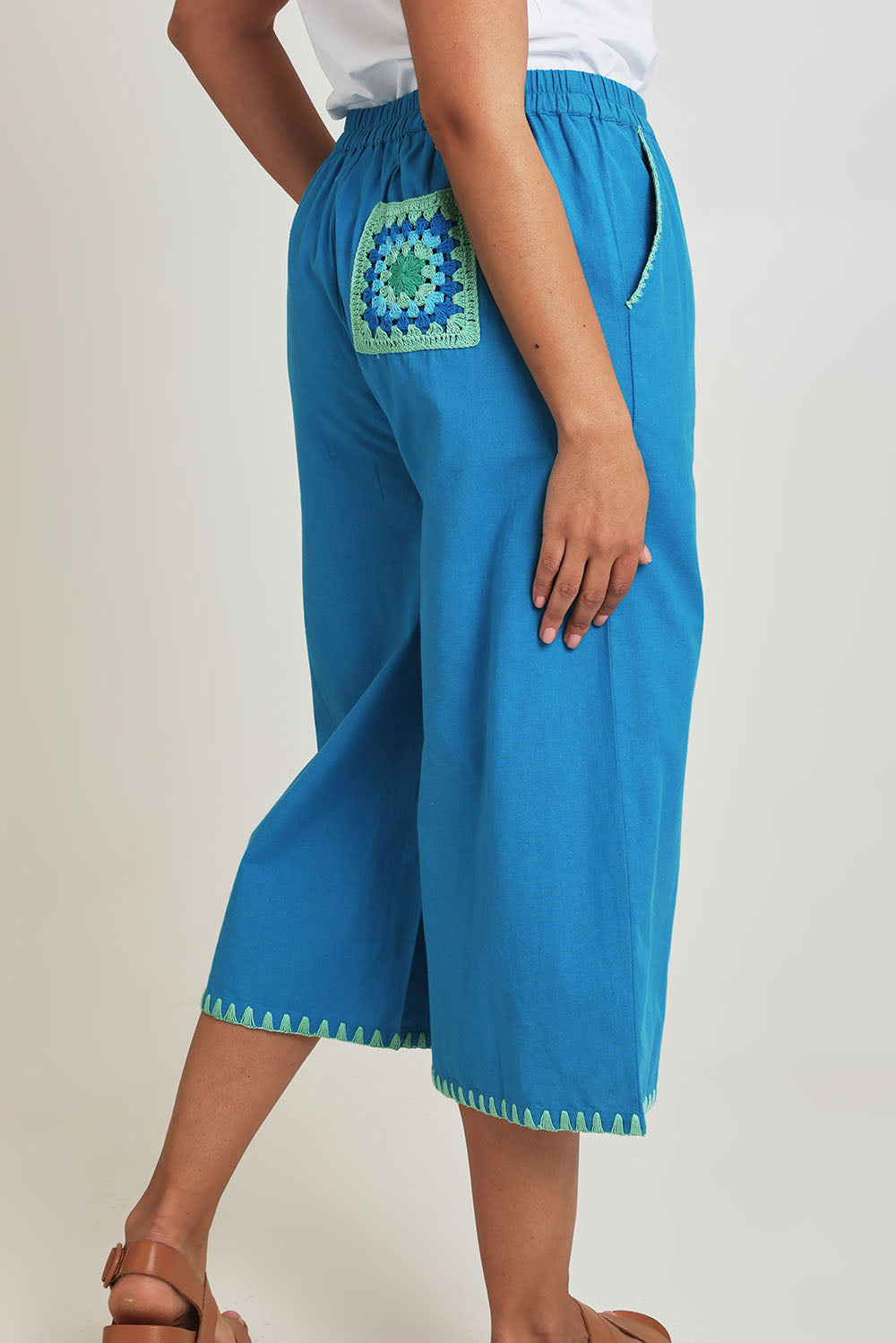 Model Terri-Leigh wearing size 14 of the Crochet Pocket Cotton Pant in colour Oceanblue (Blue), from the back