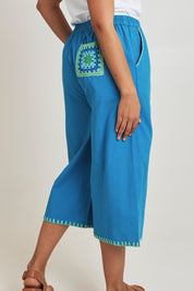 Model Terri-Leigh wearing size 14 of the Crochet Pocket Cotton Pant in colour Oceanblue (Blue), from the back
