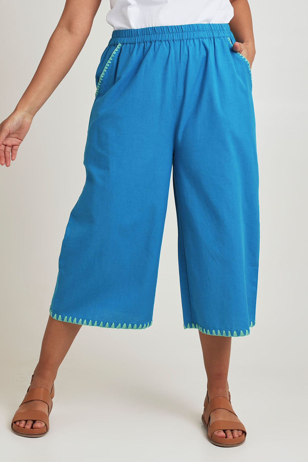 Model Terri-Leigh wearing size 14 of the Crochet Pocket Cotton Pant in colour Oceanblue (Blue), from the front, cropped image