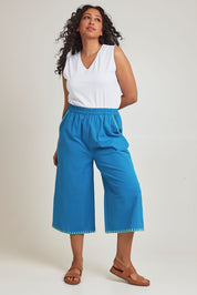 Model Terri-Leigh wearing size 14 of the Crochet Pocket Cotton Pant in colour Oceanblue (Blue), from the front, showing the whole outfit