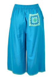 Product shot of the Crochet Pocket Cotton Pant in colour Oceanblue (Blue), from the back
