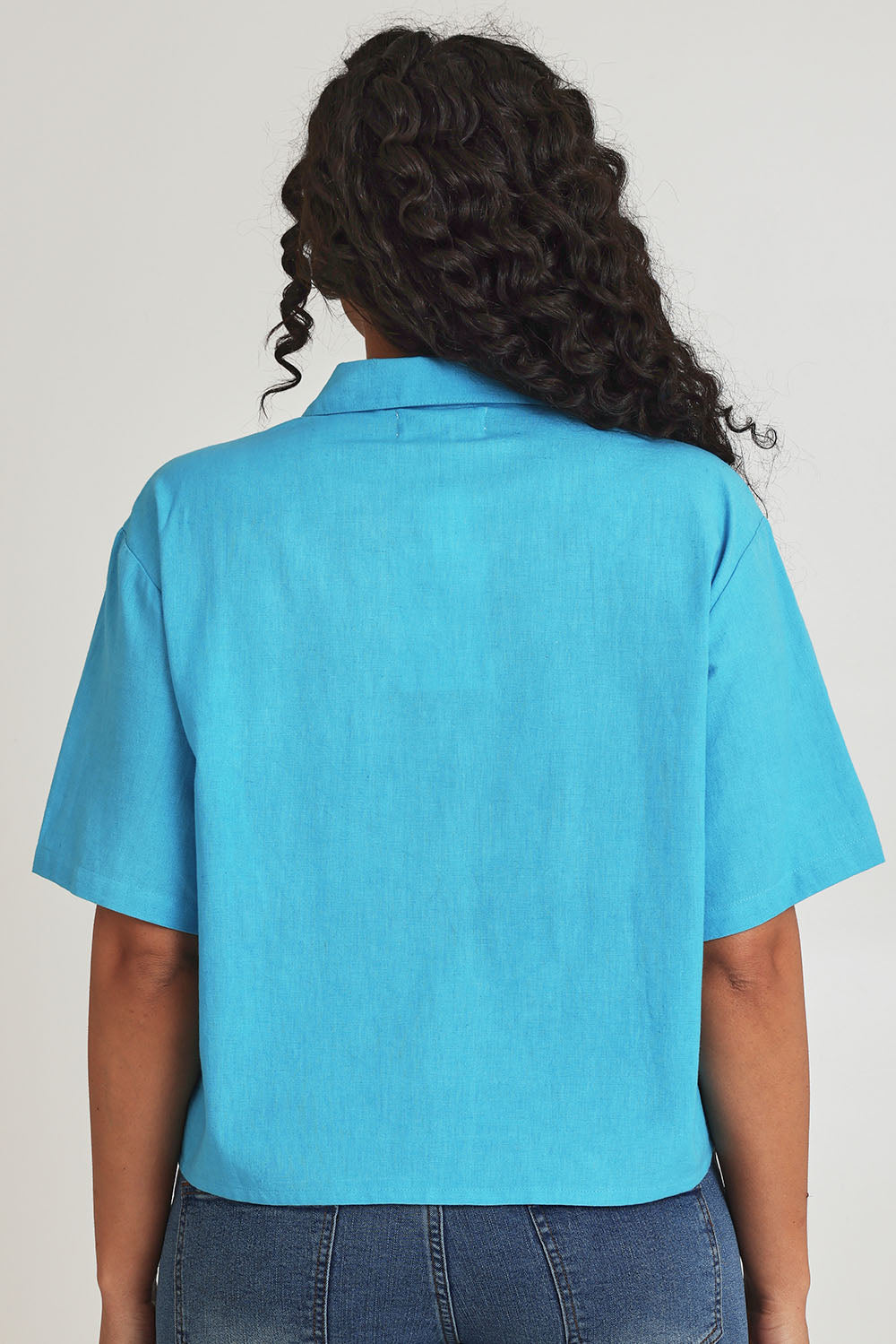 Model Terri-Leigh wearing size 14 of the Crochet Pocket Cotton Shirt in colour Skyblue (Blue), from the back