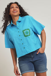Model Terri-Leigh wearing size 14 of the Crochet Pocket Cotton Shirt in colour Skyblue (Blue), from the front, cropped image