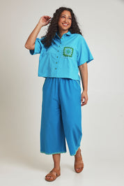 Model Terri-Leigh wearing size 14 of the Crochet Pocket Cotton Shirt in colour Skyblue (Blue), from the front, showing the whole outfit