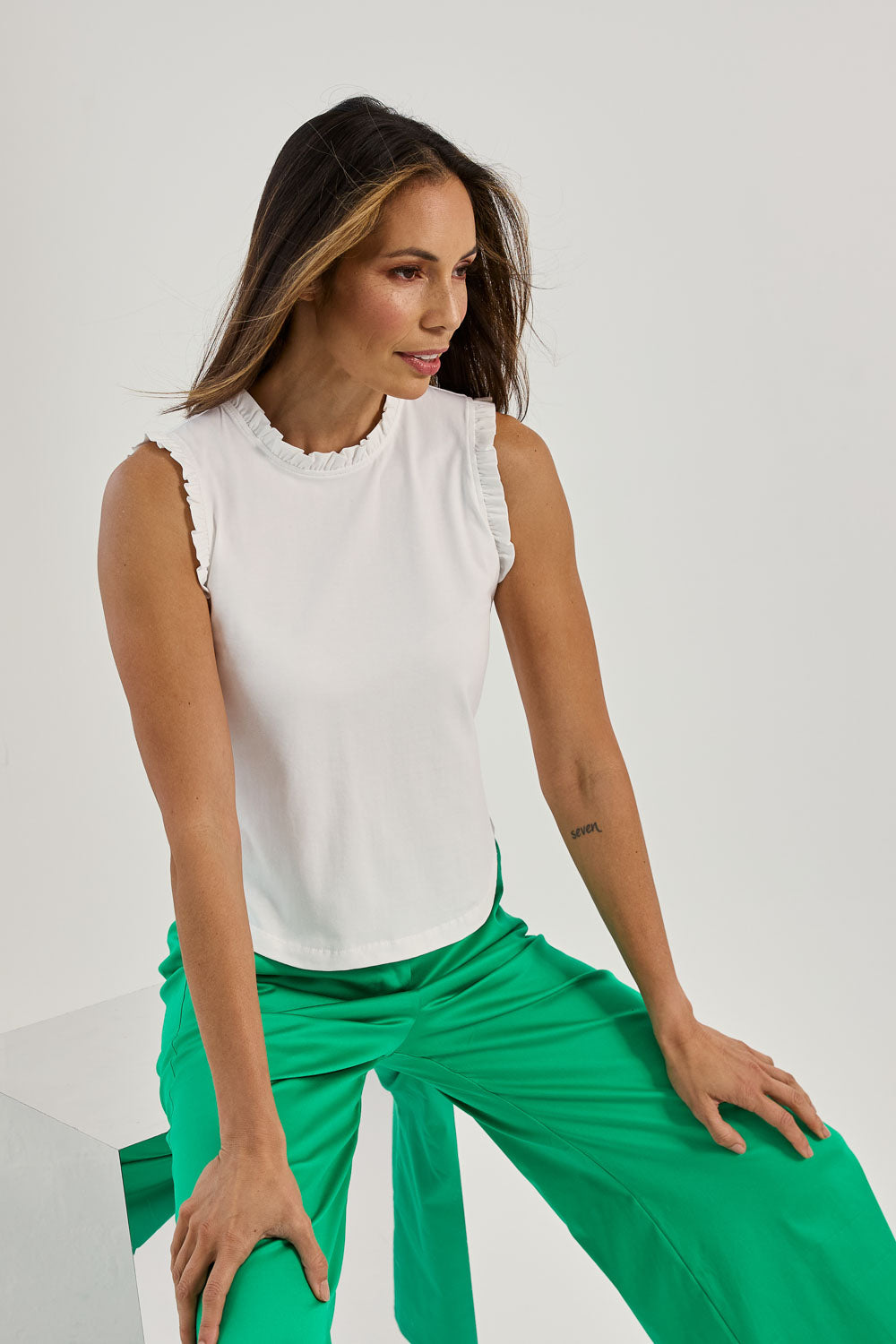 Model Amanda wearing size 10 of the Cotton Frill Tank in colour White (White), from the front, showing the whole outfit