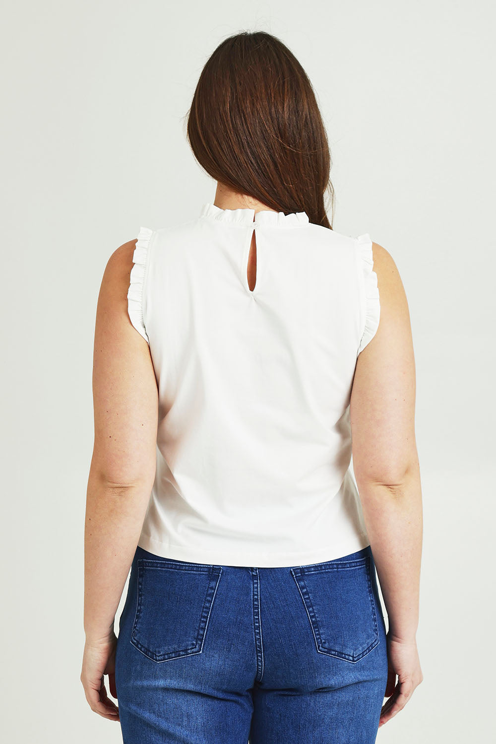 Model Jane wearing size 14 of the Cotton Frill Tank in colour White (White), from the back