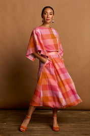 Model Katie wearing size 10 of the Yarn Dyed Cotton Wide Sleeve Top in colour Sherbet (Pink), from the front, showing the whole outfit