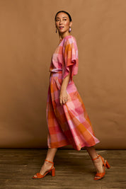 Model Katie wearing size 10 of the Yarn Dyed Cotton Pleat Front Skirt in colour Sherbet (Pink), from the front, showing the whole outfit