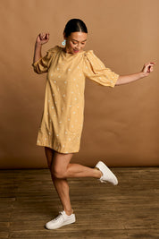 Model Katie wearing size 10 of the Daisy Cotton Sundress in colour Daisycheck, from the front, showing the whole outfit