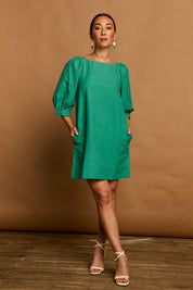Model Katie wearing size 10 of the Puff Sleeve Cotton Dress in colour Green (Green), from the front, showing the whole outfit