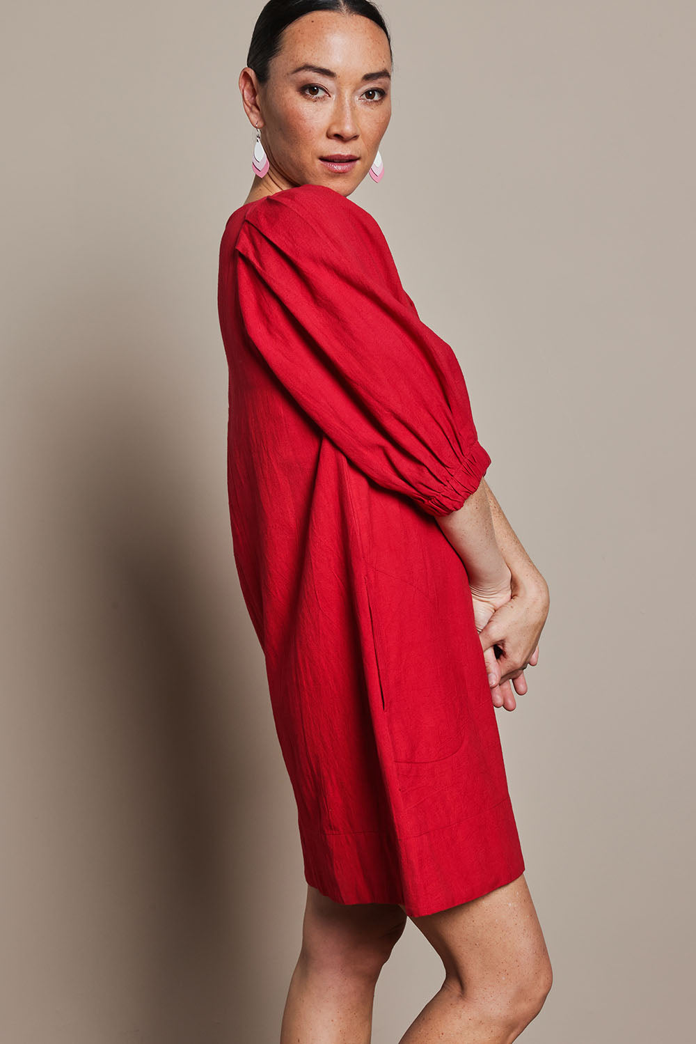 Model Katie wearing size 10 of the Puff Sleeve Cotton Dress in colour Ribbonred (Red), from the front, cropped image