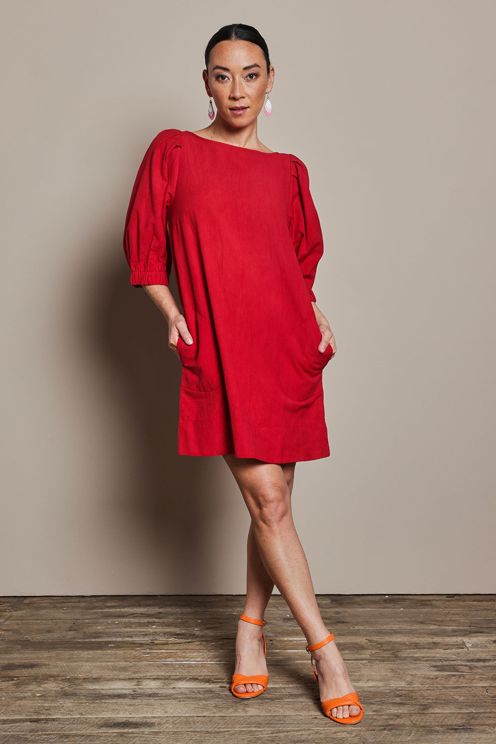 Model Katie wearing size 10 of the Puff Sleeve Cotton Dress in colour Ribbonred (Red), from the front, showing the whole outfit