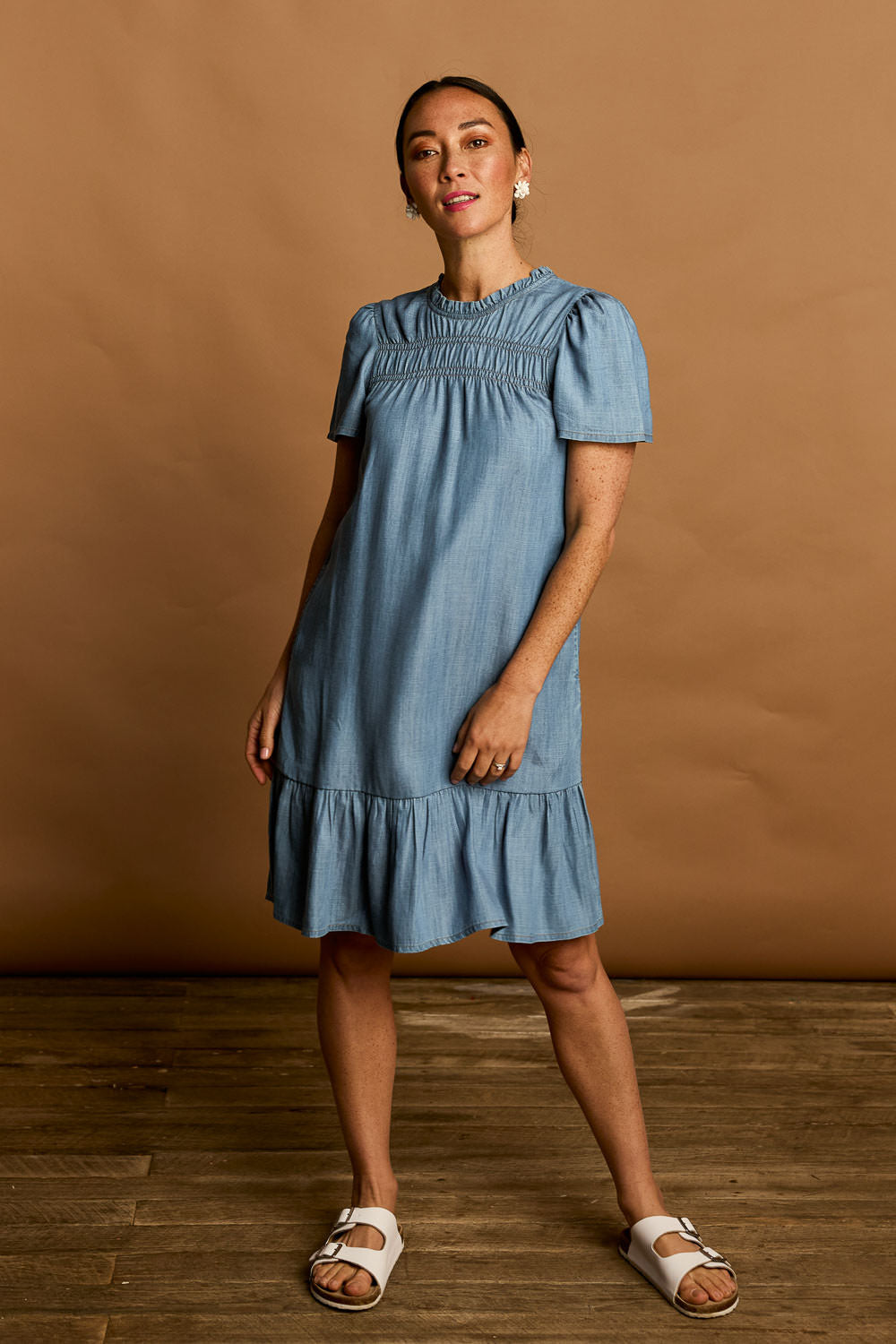 Model Katie wearing size 10 of the Frill Hem Dress in colour Blue (Blue), from the front, showing the whole outfit