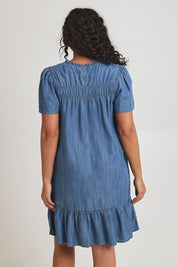 Model Terri-Leigh wearing size 14 of the Frill Hem Dress in colour Blue (Blue), from the back