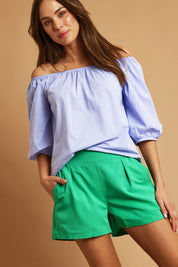 Model Madeline wearing size 10 of the Pull On Shorts in colour Applegrn (Green), from the front, showing the whole outfit