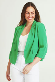 Model Jane wearing size 14 of the Double Breasted Blazer in colour Applegrn (Green), from the front, cropped image
