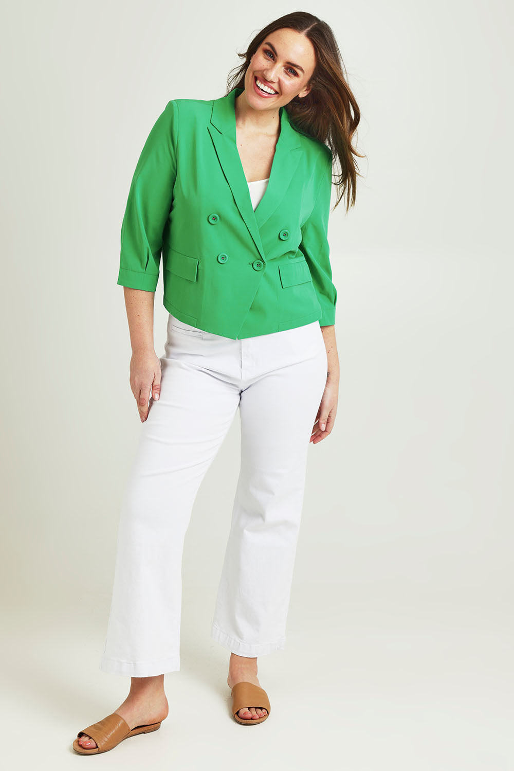 Model Jane wearing size 14 of the Double Breasted Blazer in colour Applegrn (Green), from the front, showing the whole outfit