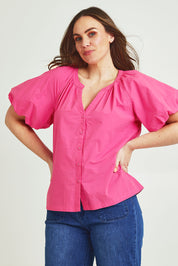 Model Jane wearing size 14 of the Puff Sleeve Cotton Shirt in colour Carnation (Pink), from the front, cropped image