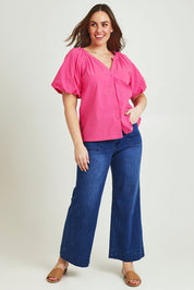 Model Jane wearing size 14 of the Puff Sleeve Cotton Shirt in colour Carnation (Pink), from the front, showing the whole outfit