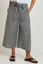 Model Terri-Leigh wearing size 14 of the Cotton Waist Tie Pants in colour Gingham (Black), from the front, cropped image