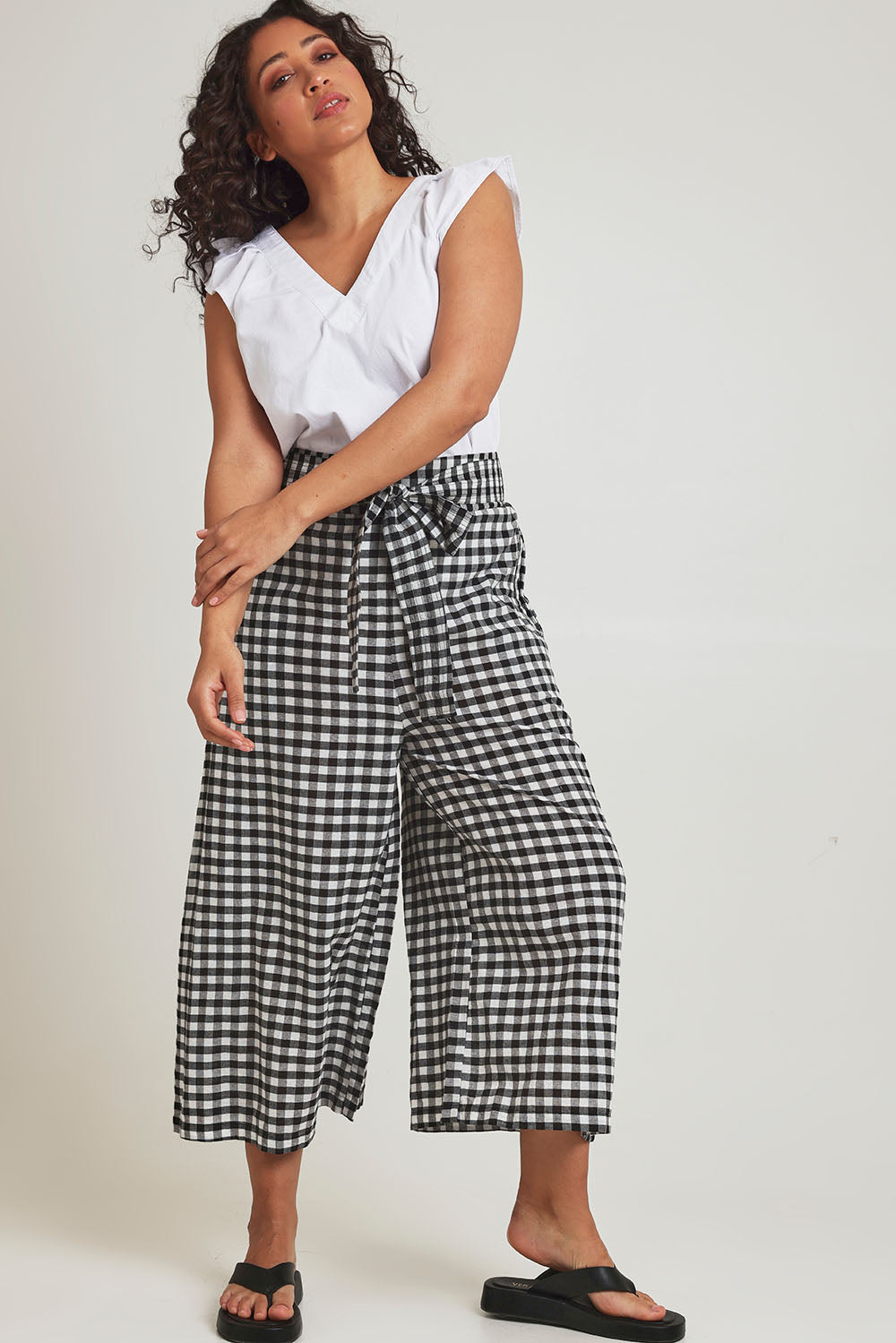 Model Terri-Leigh wearing size 14 of the Cotton Waist Tie Pants in colour Gingham (Black), from the front, showing the whole outfit