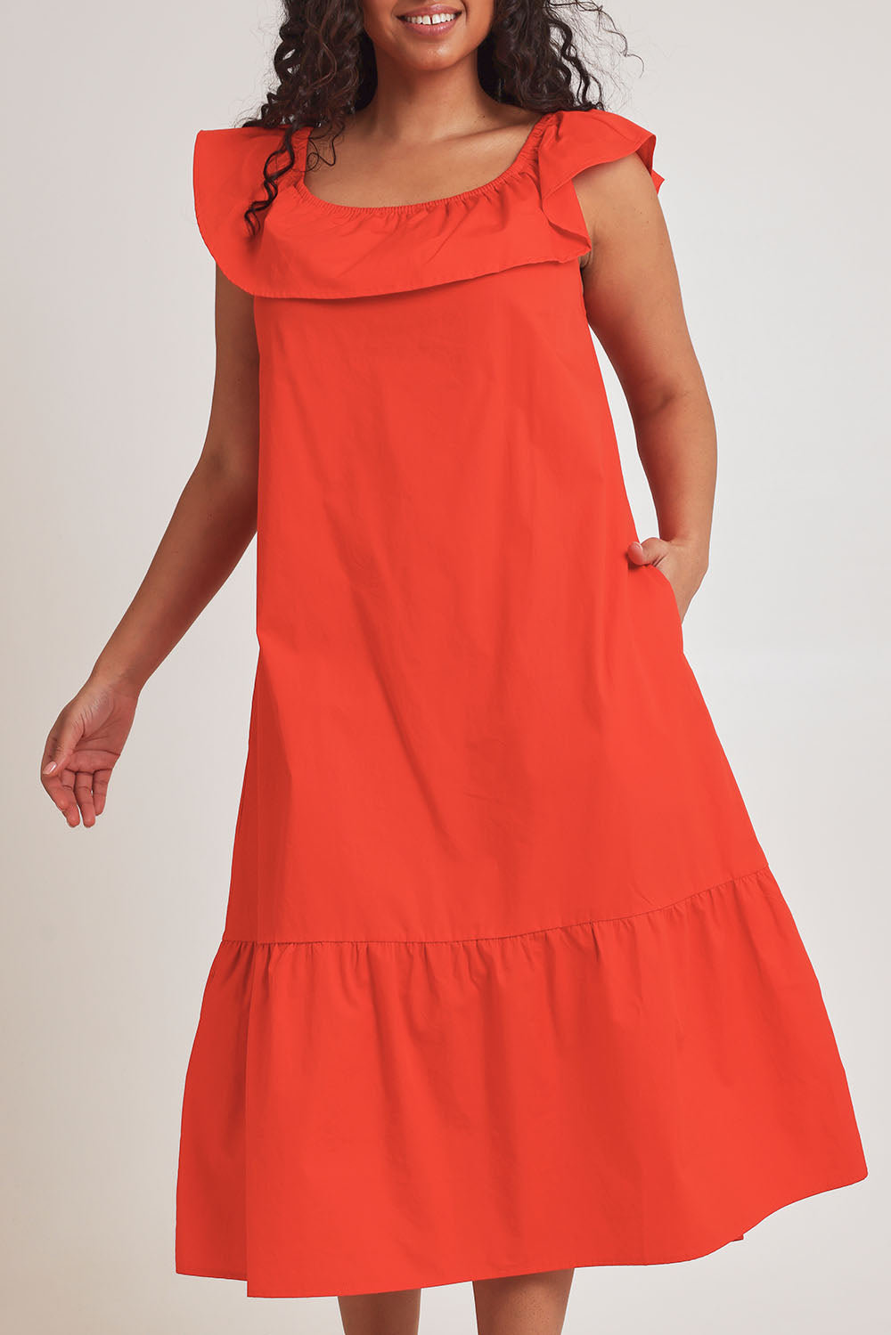 Model Terri-Leigh wearing size 14 of the On Or Off The Shoulder Cotton Dress in colour Flame (Red), from the front, cropped image