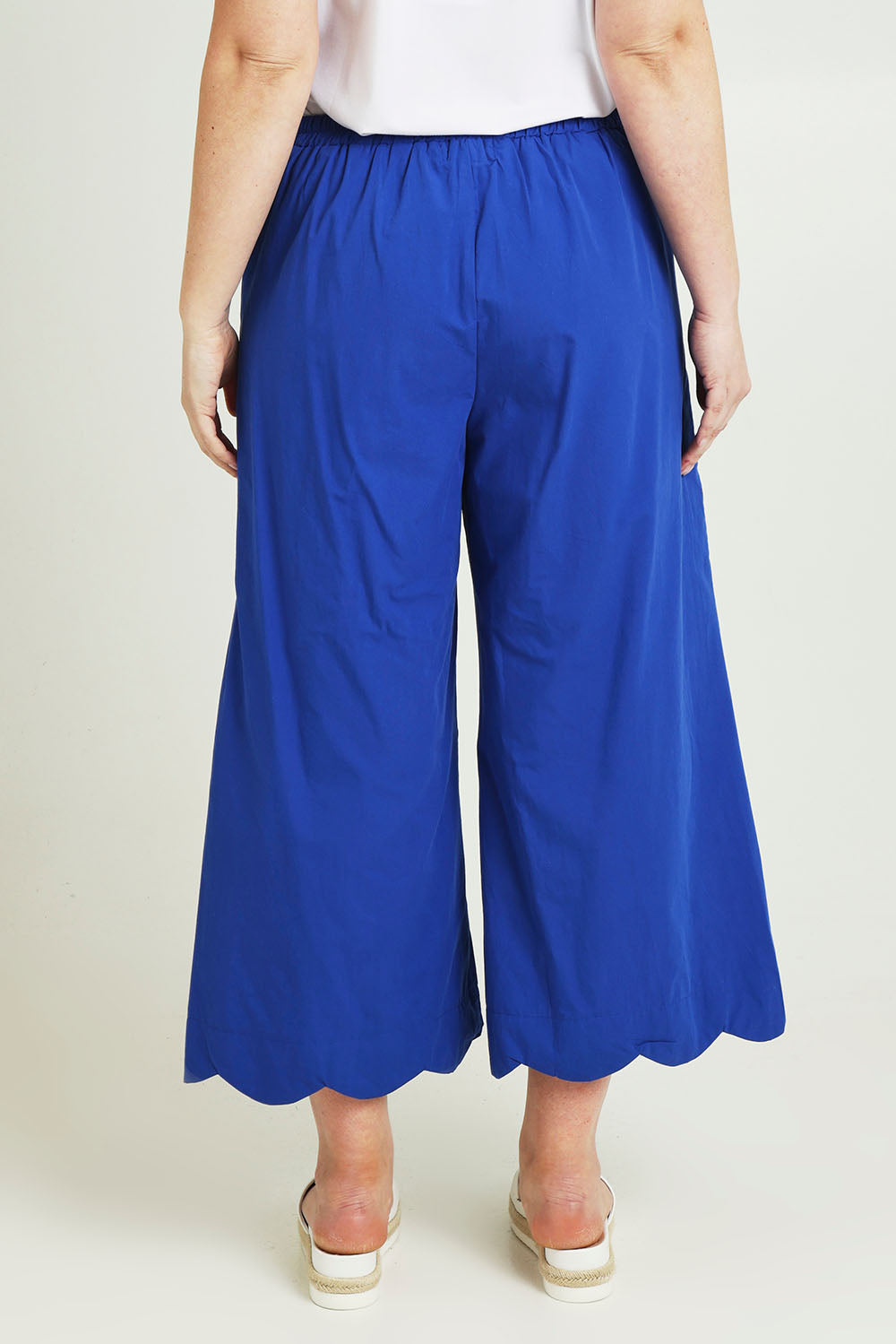 Model Jane wearing size 14 of the Scalloped Hem Cotton Pant in colour Palaceblue (Blue), from the back