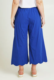 Model Jane wearing size 14 of the Scalloped Hem Cotton Pant in colour Palaceblue (Blue), from the back